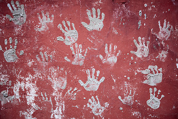 Image showing Wall decorated with amusing prints of palms