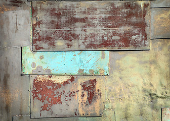 Image showing Wall covered with sheets of rusty old steel background