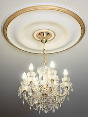 Image showing Big electric chandelier hanging down from a ceiling