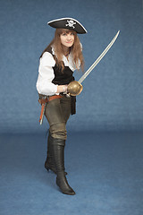 Image showing Sea pirate of a female with sabre on blue background