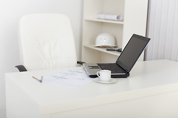 Image showing Workplace of engineer at office with laptop