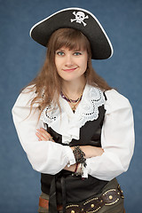 Image showing Pirate woman emotionally poses on blue background