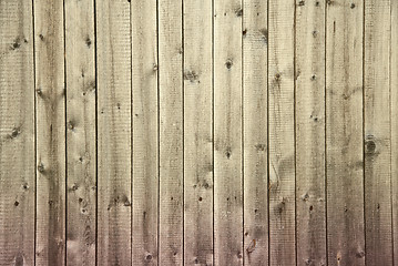 Image showing Old dirty wooden fence begun to rot from below background