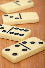 Image showing Bones of dominoes on wooden background close up