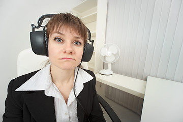 Image showing Ridiculous woman dressed on head big ear-phones