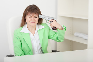 Image showing Young woman commits suicide on workplace at office