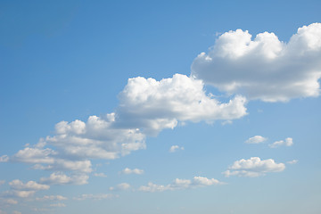 Image showing Blue sky with cumulus clouds built abreast