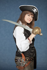 Image showing Sea pirate of a female with sabre on blue background