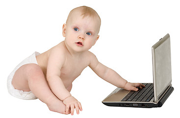 Image showing Small nice child with laptop isolated on white background