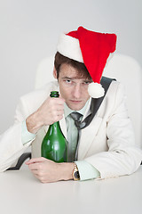 Image showing Young man celebrates Christmas at office