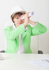 Image showing Girl in helmet looks afar through drawing