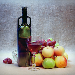 Image showing Art still-life from wine and apples against sacking