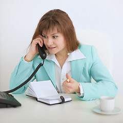 Image showing Girl - secretary emotionally speaks on the phone