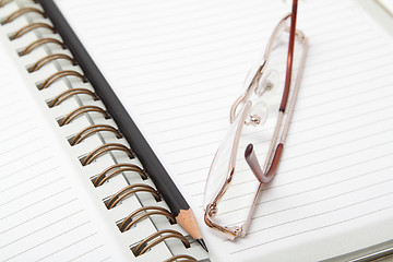 Image showing Diary, pencil and glasses