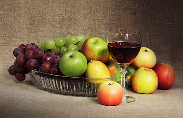 Image showing Classical still-life with fruit and glass of red wine
