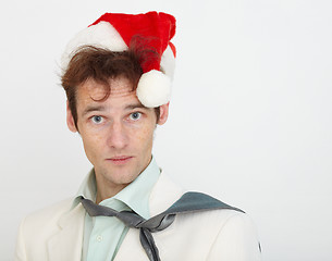 Image showing Portrait of young man in Christmas cap on white background