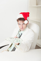 Image showing People in Christmas hat gives us money