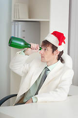 Image showing Businessman in white jacket celebrates Christmas