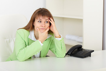 Image showing Young woman with concentration thinks on workplace