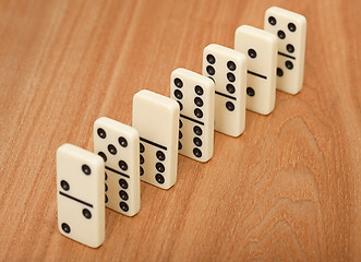 Image showing line from seven dominoes on wooden surface