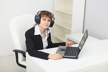 Image showing Young woman with big stereos ear-phones on head