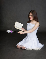 Image showing Girl - fairy with magic wand and book in hands