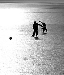 Image showing 2 Ice-skating boys with a ball I