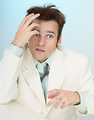 Image showing Madly frightened tousled amusing businessman