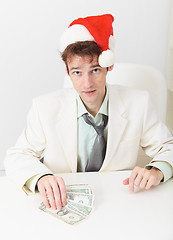 Image showing Young businessman has received new year s premium