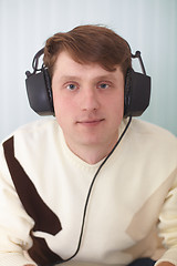 Image showing Portrait of person in big stereos ear-phones