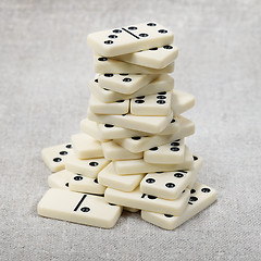 Image showing Big heap of ancient counters of dominoes