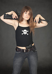 Image showing Modern pirate of female with rifle on black background