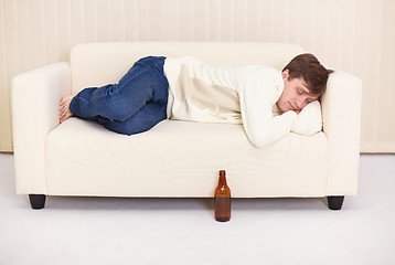 Image showing People comfortable sleeps on sofa having got drunk beer