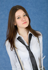 Image showing Portrait of young beautiful girl on blue background