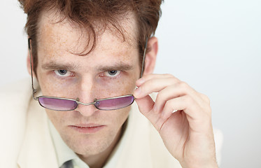 Image showing Severe look of young man over spectacles