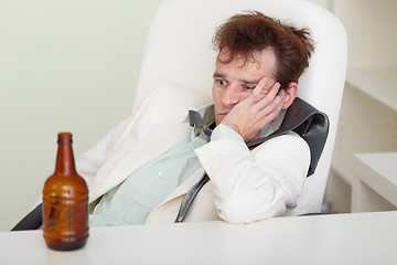 Image showing Young drunkard with hangover after holiday