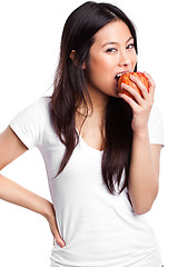 Image showing Asian woman eating apple