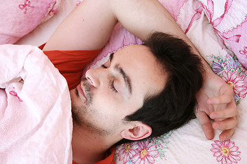 Image showing Young man sleeping .