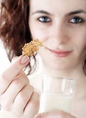 Image showing Young people eating milk with cereals