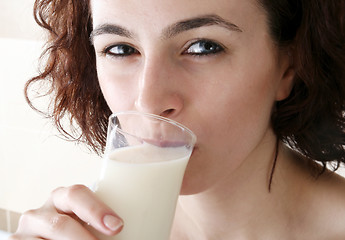 Image showing Young people eating milk with cereals