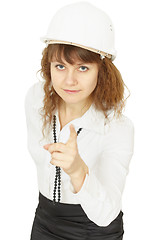 Image showing Young beautiful woman engineer in helmet on white