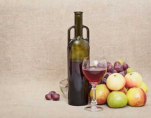 Image showing Bottle, glass and fruit on canvas - still-life