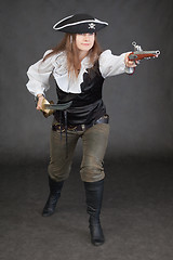 Image showing Woman in a costume of sea pirate attack