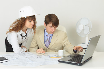 Image showing Young experts are occupied by work at office