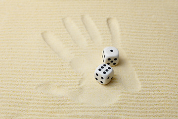 Image showing Print of a palm with dices lying on it