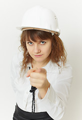 Image showing Beautiful girl - engineer under safety precautions in helmet