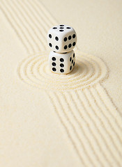 Image showing Dices on sand in rock garden