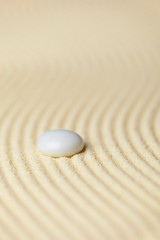 Image showing White drop on surface of yellow sand