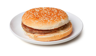 Image showing Stale hamburger on a plate isolated on white background