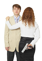 Image showing Man and woman armed by pistol isolated on a white background